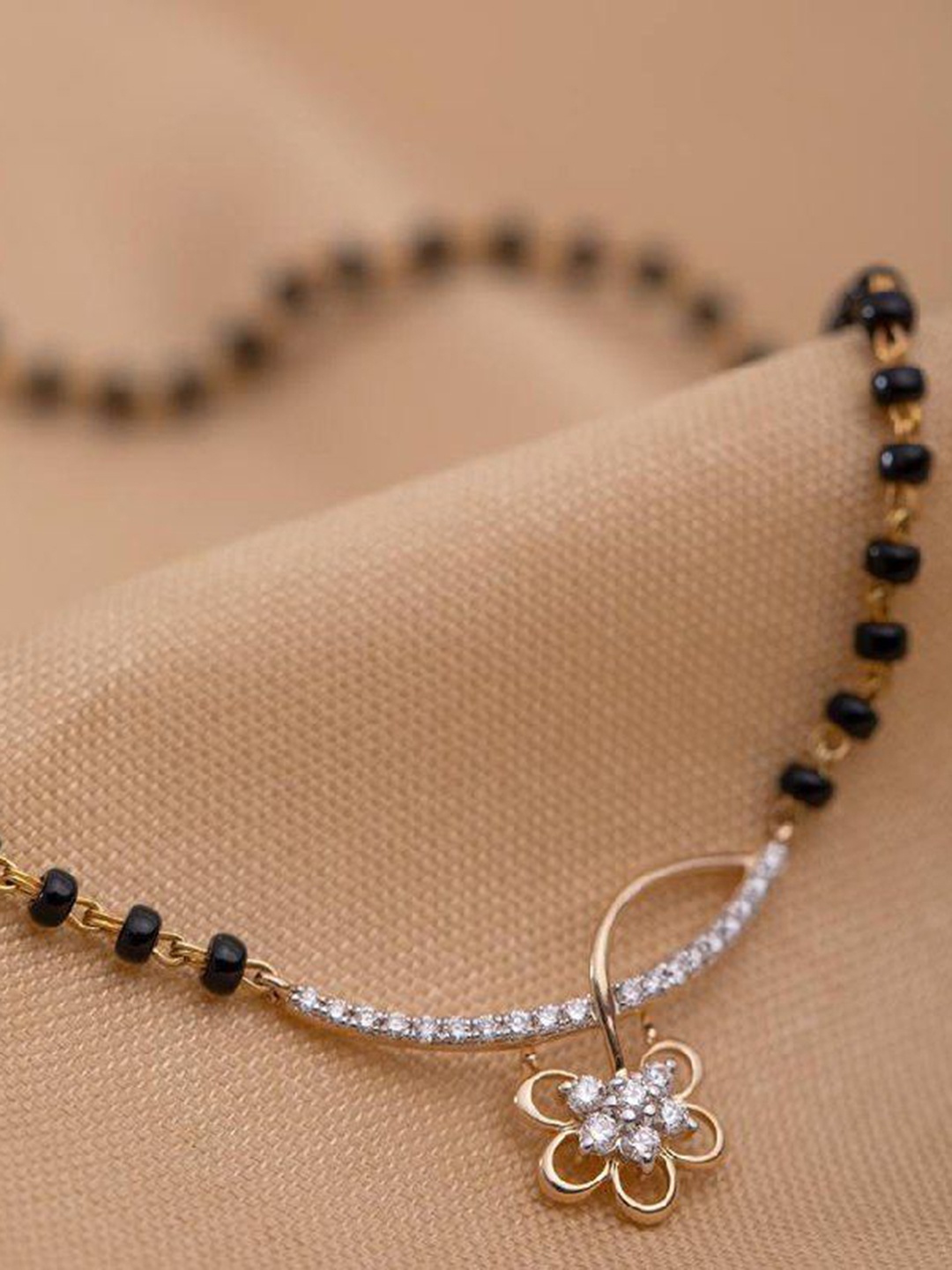 

HETPRIT Gold-Plated American Diamond Studded and Beaded Mangalsutra