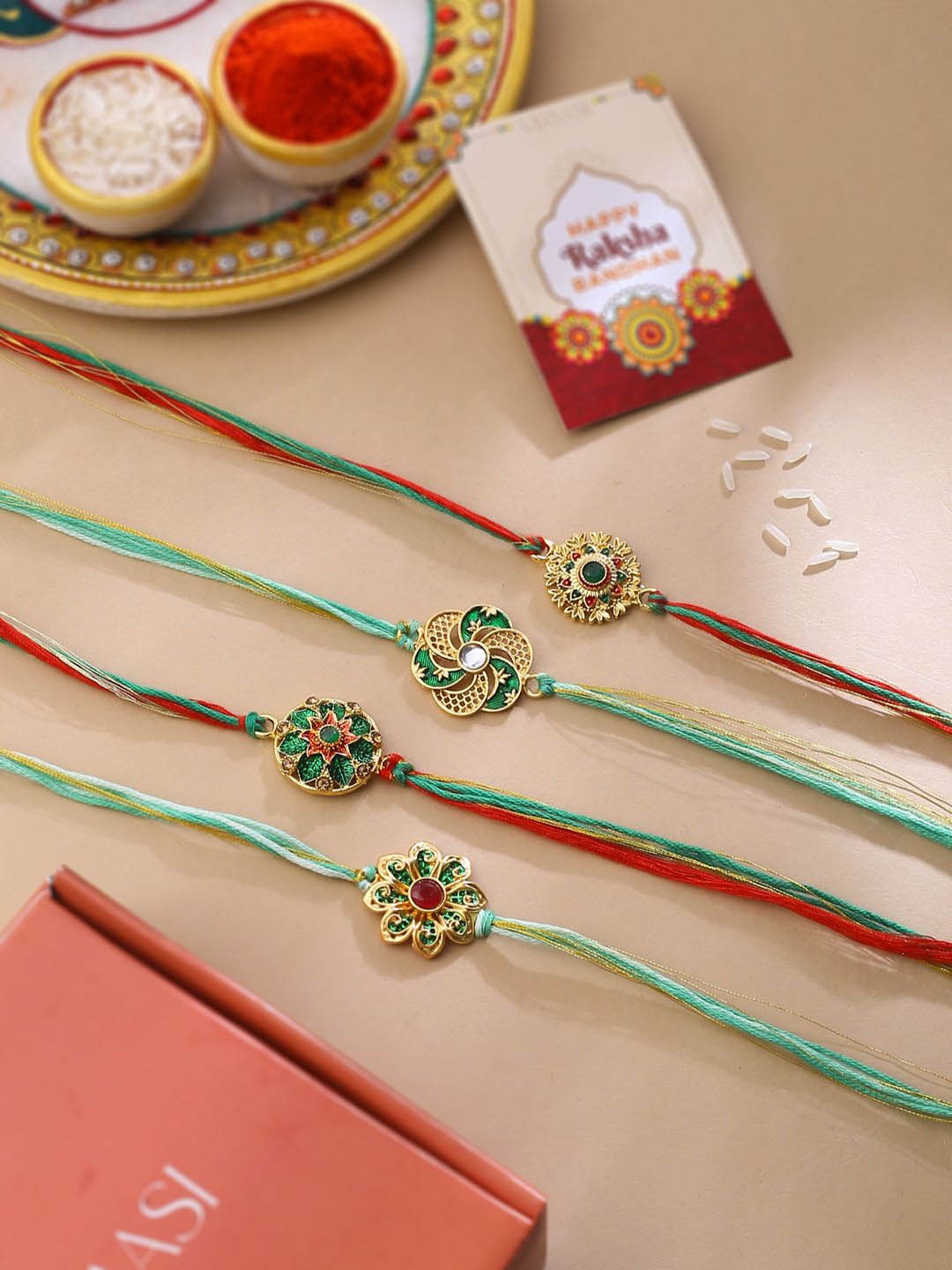 

Natures Buggy Set of 4 Stone Studded Thread Rakhis, Gold