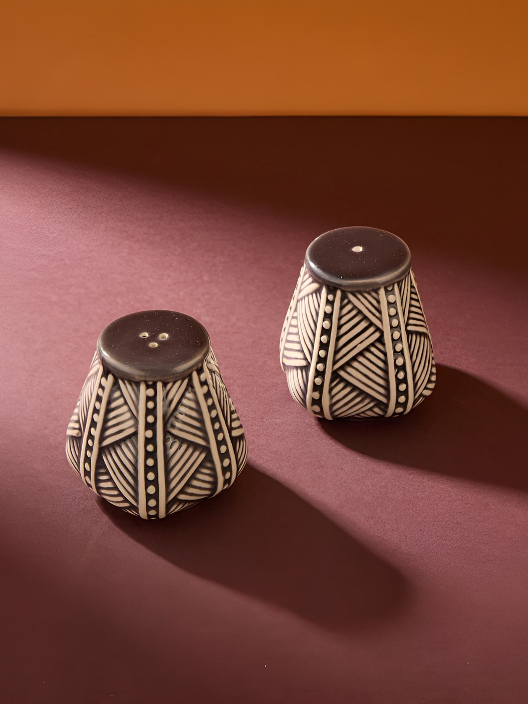 

Fabindia 2Pcs Beige Colored & Brown Printed Salt & Pepper Shakers