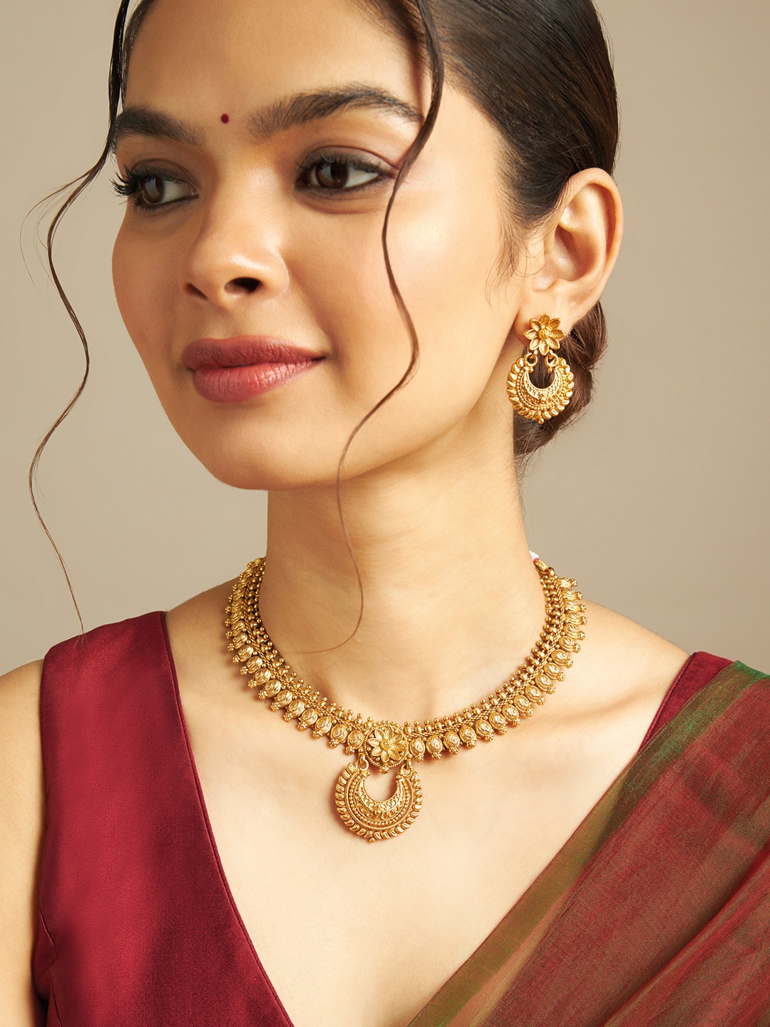 

Kushal's Fashion Jewellery Gold-Plated Antique Necklace & Earrings