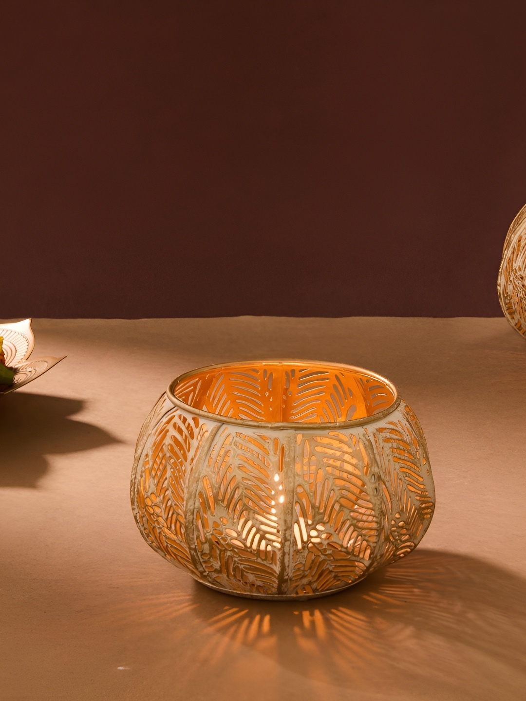 

Fabindia White & Gold Toned Textured Candle Holder