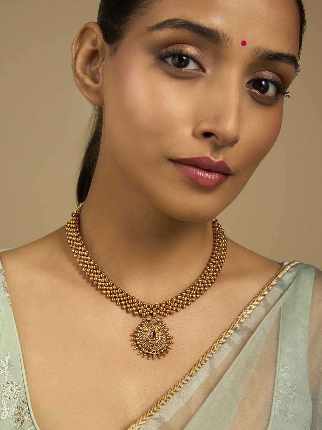 

Kushal's Fashion Jewellery Gold-Plated Artificial Stones Studded Antique Necklace