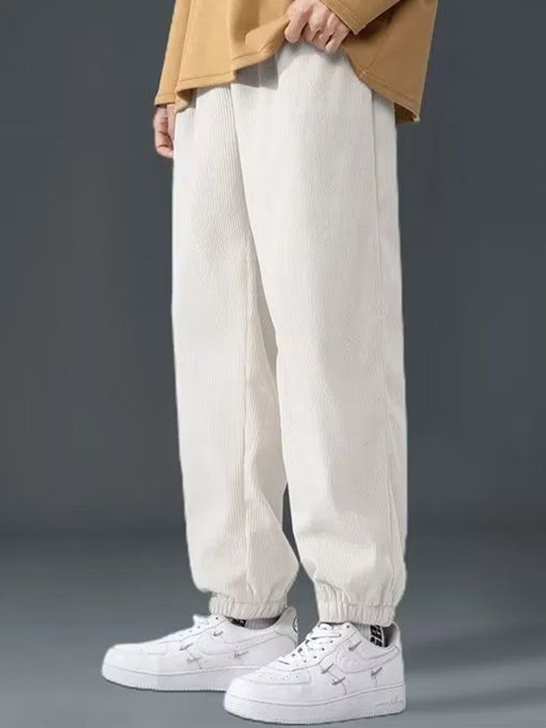 

StyleCast Men Solid Loose Fit Pleated Joggers Trousers, Beige