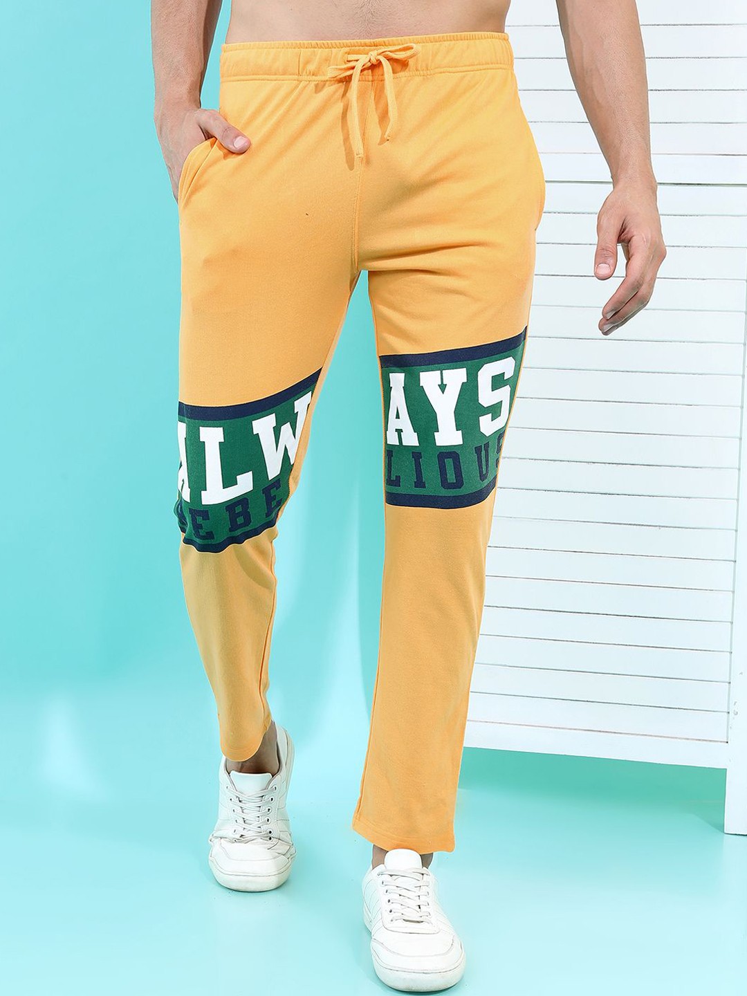 

HIGHLANDER Typography Printed Men Mid-Rise Track Pants, Yellow