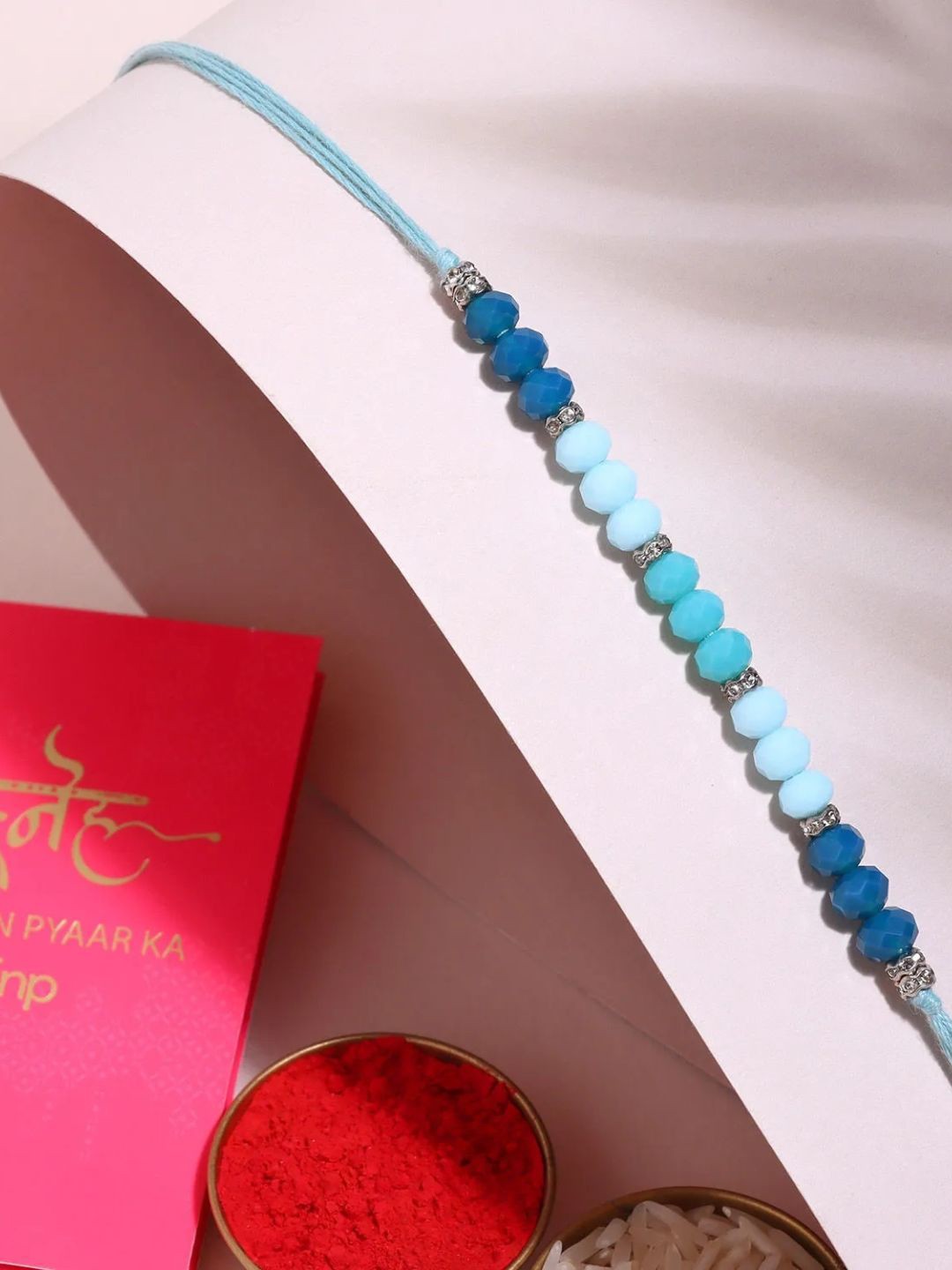 

fnp Tranquil Harmony Beaded Rakhi Silver Selections, Blue