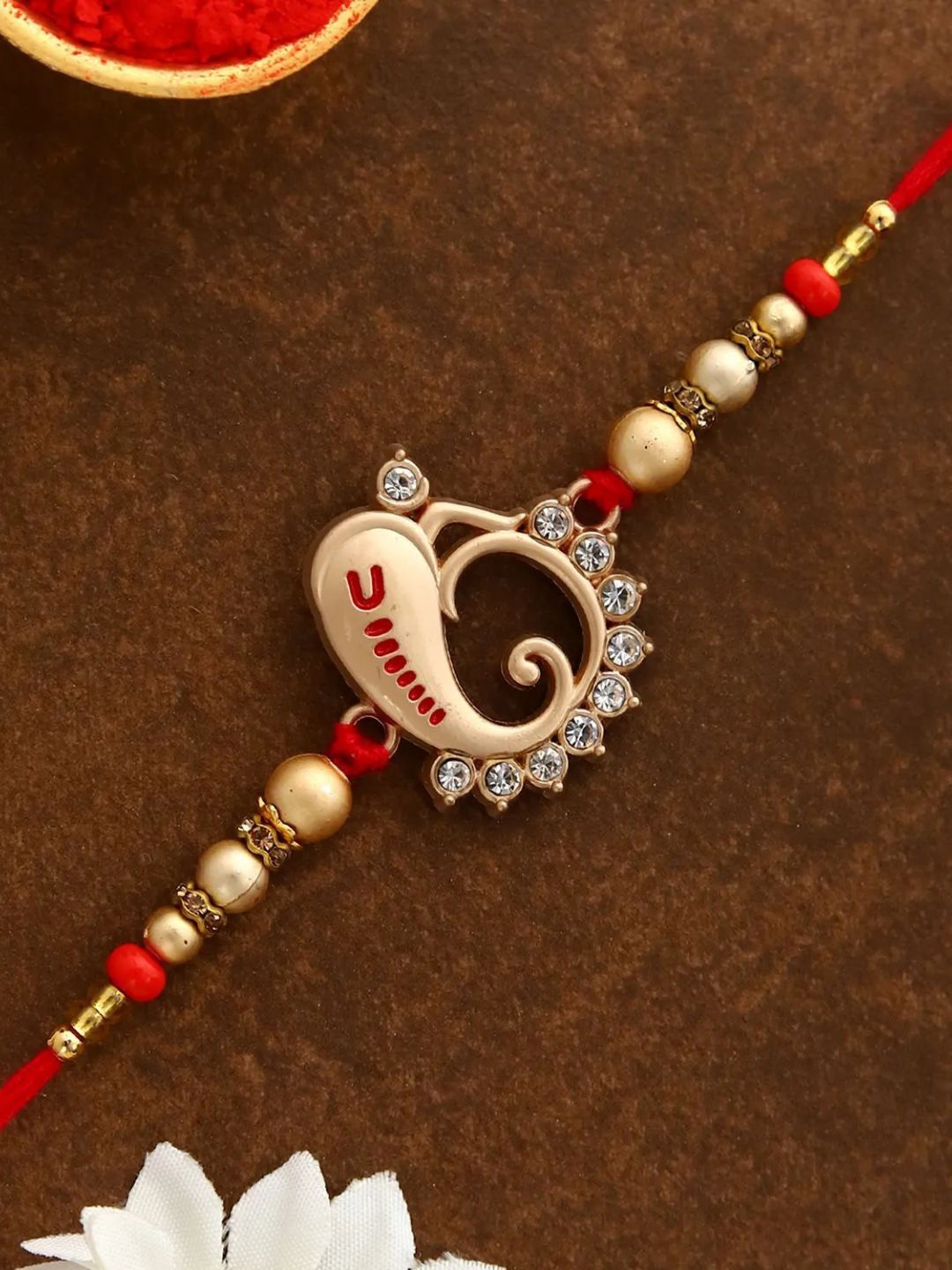 

fnp Divine Lord Ganes Rakhi American Diamond, Gold