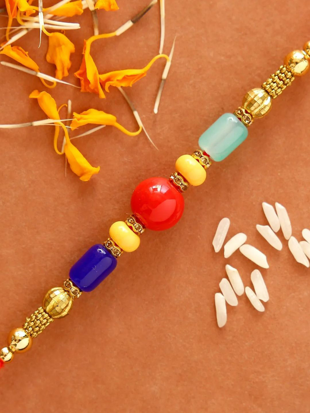 

fnp Polychromatic Skyline Gemstones Rakhi Mauli Rakhis, Blue