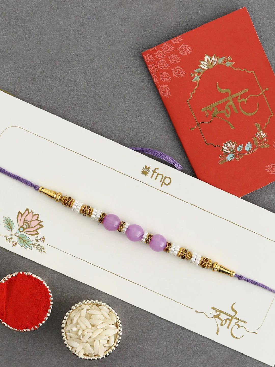 

fnp Graceful Pearl Ethnic Rakhi Mauli Rakhis, Purple
