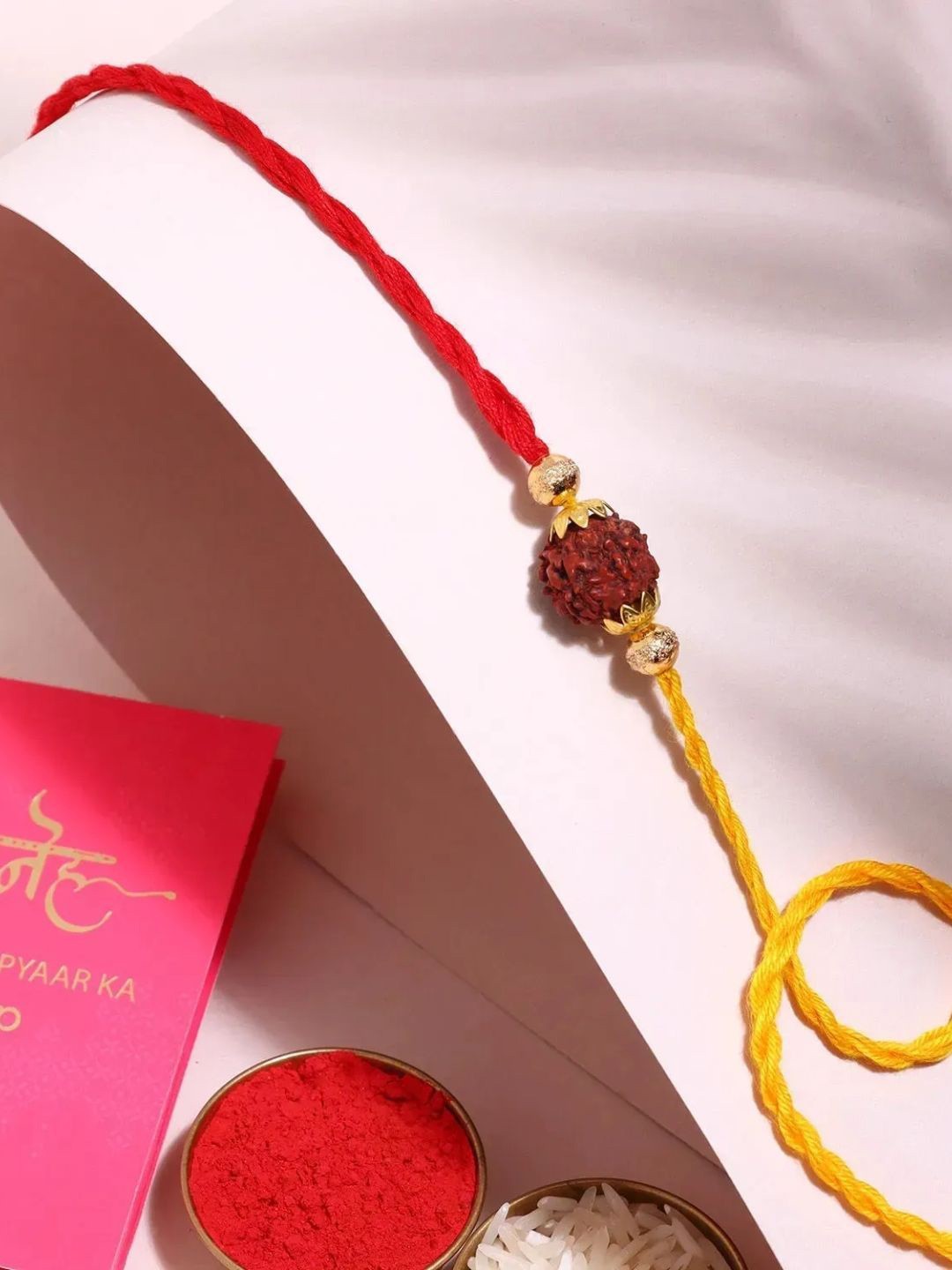 

fnp Divine Harmony Rudraksha Rakhi Magical Evil Eye, Maroon
