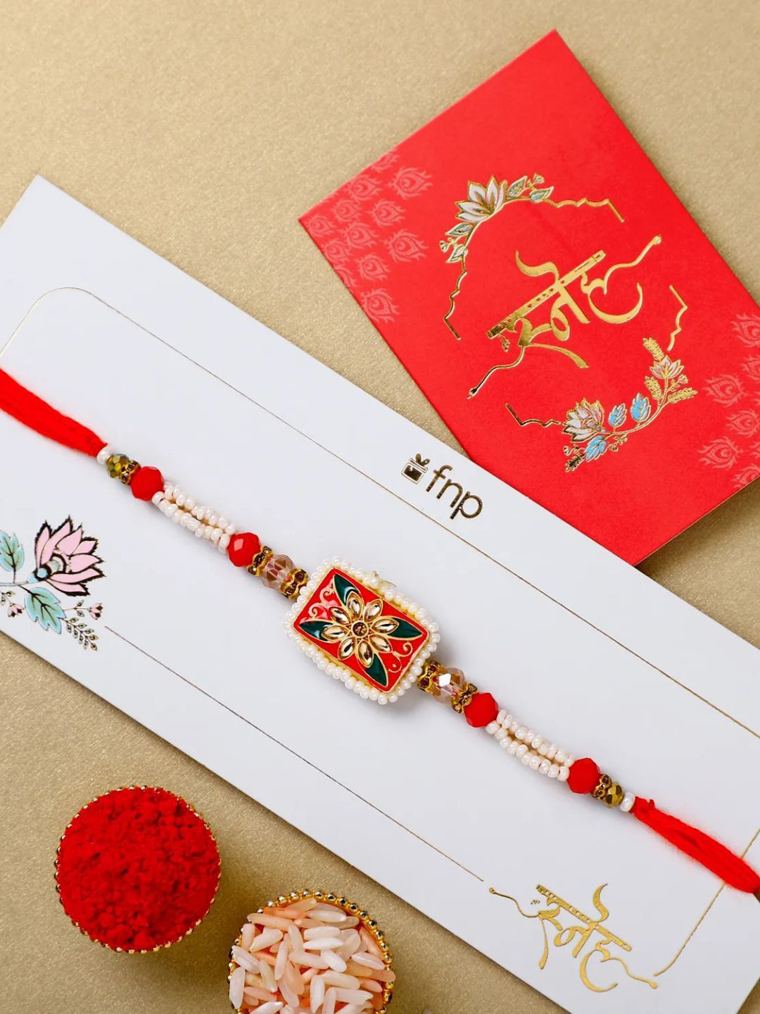 

fnp Opulent Pearl Affair Rakhi Bhaiya-Bhabhi Rakhis, Red