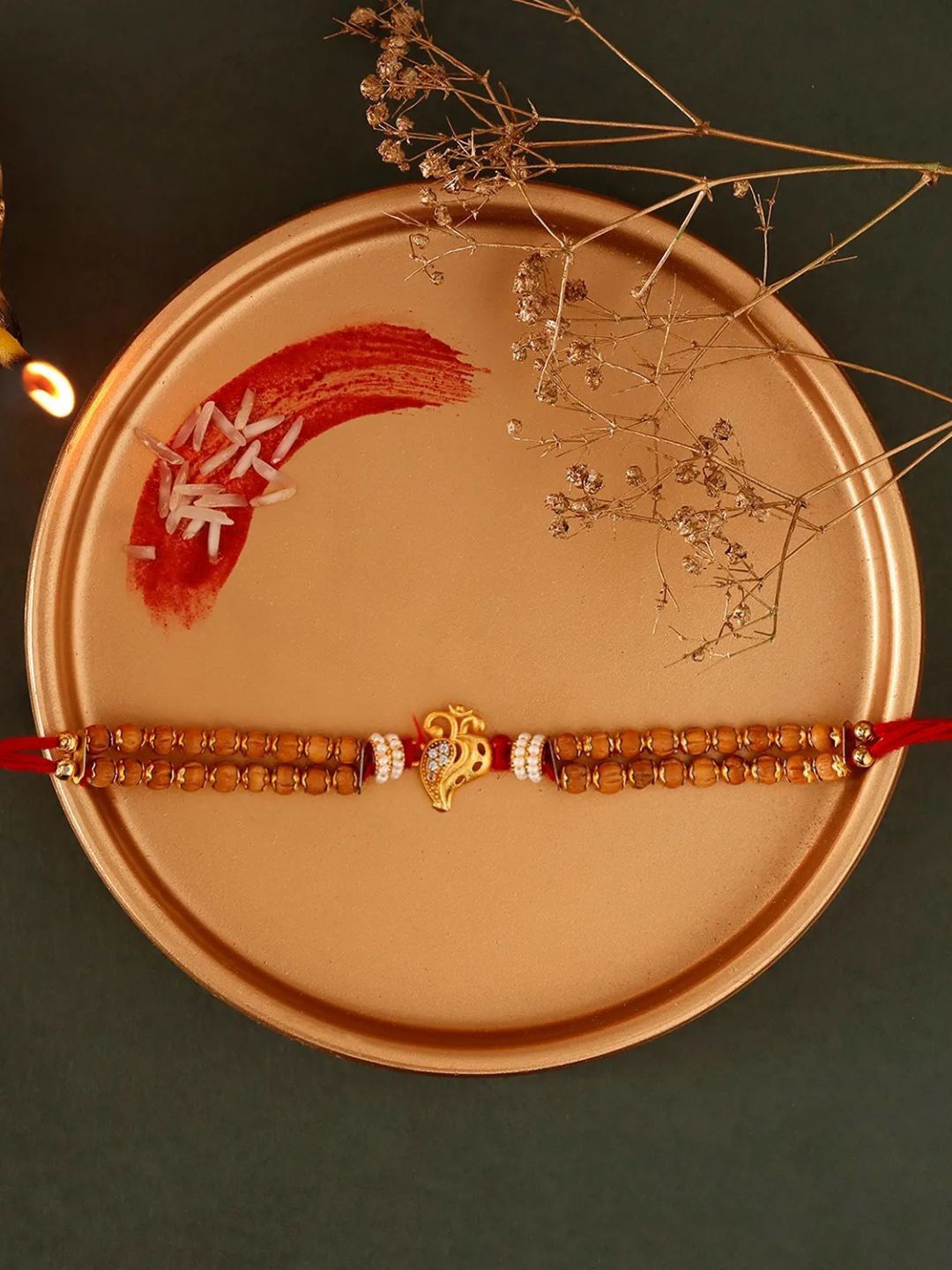 

fnp Sneh Om Blessed Rakhi American Diamond, Gold