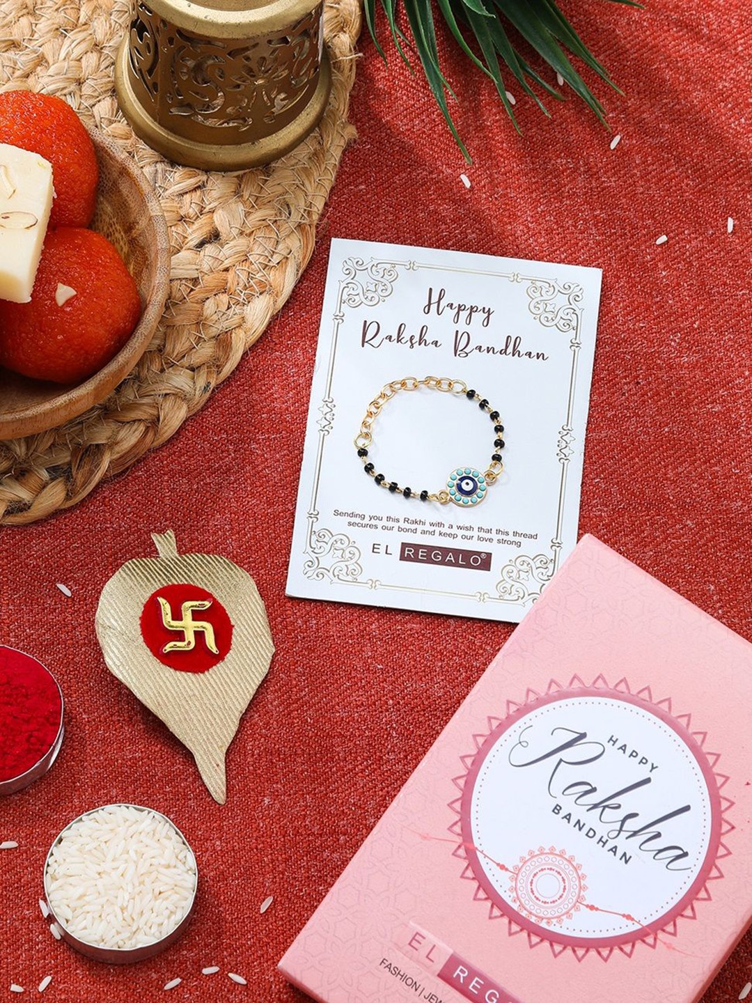 

EL REGALO Stones studded & Beaded Evil Eye Rakhi With Roli Chawal & Card, Gold