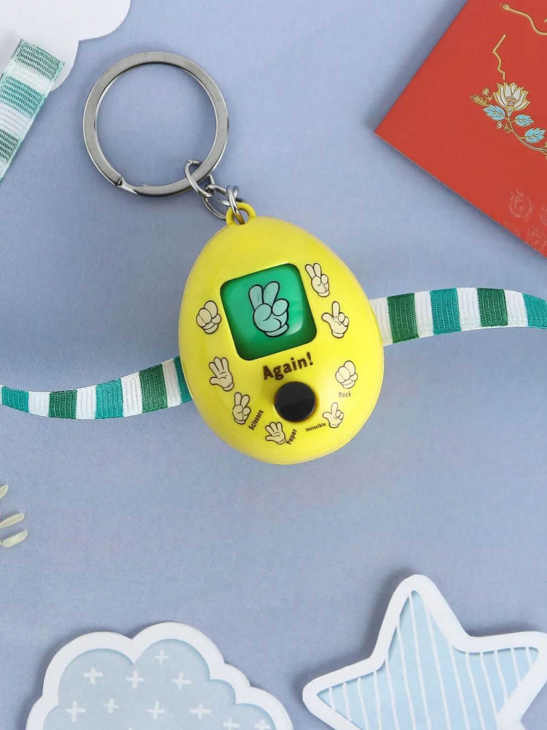 

fnp Joyful Rock Paper Scissors Toy Keychain Rakhi Traditional Kundan, Yellow