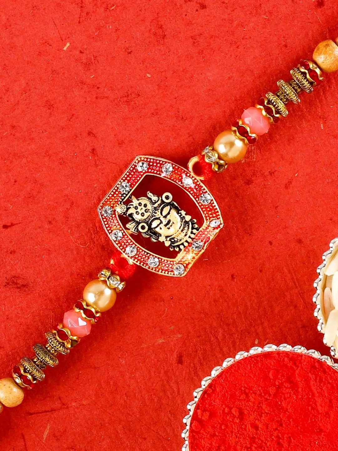 

fnp Auspicious Krishna Rakhi Traditional Kundan, Red