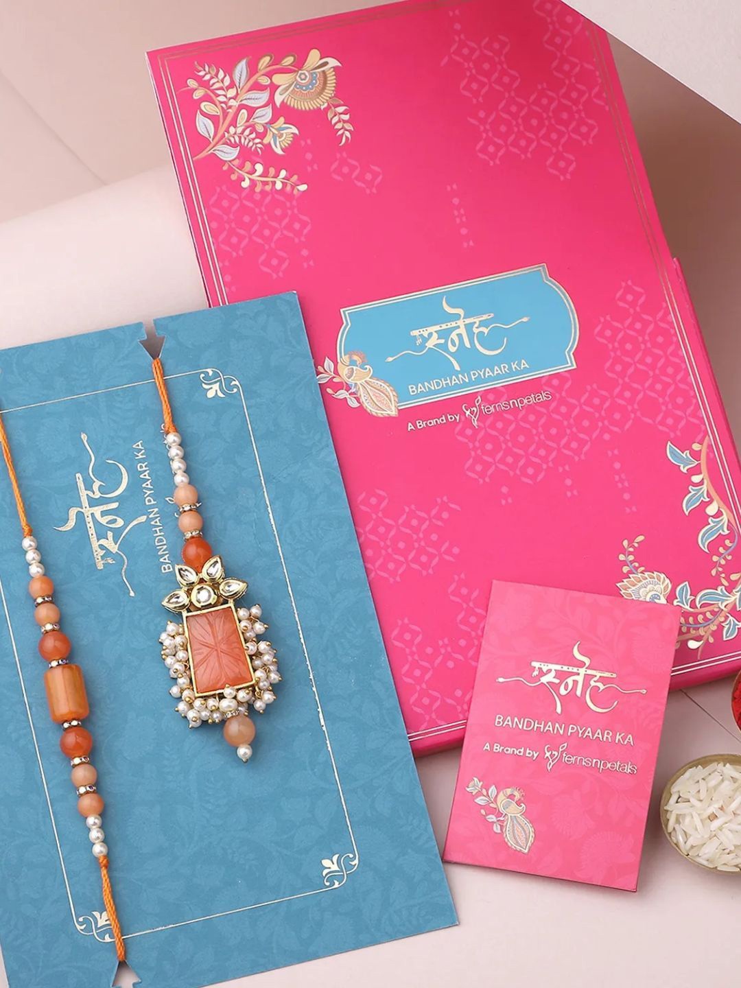 

fnp Sneh Vibrant Stone Bhaiya Bhabhi Rakhi American Diamond, Orange