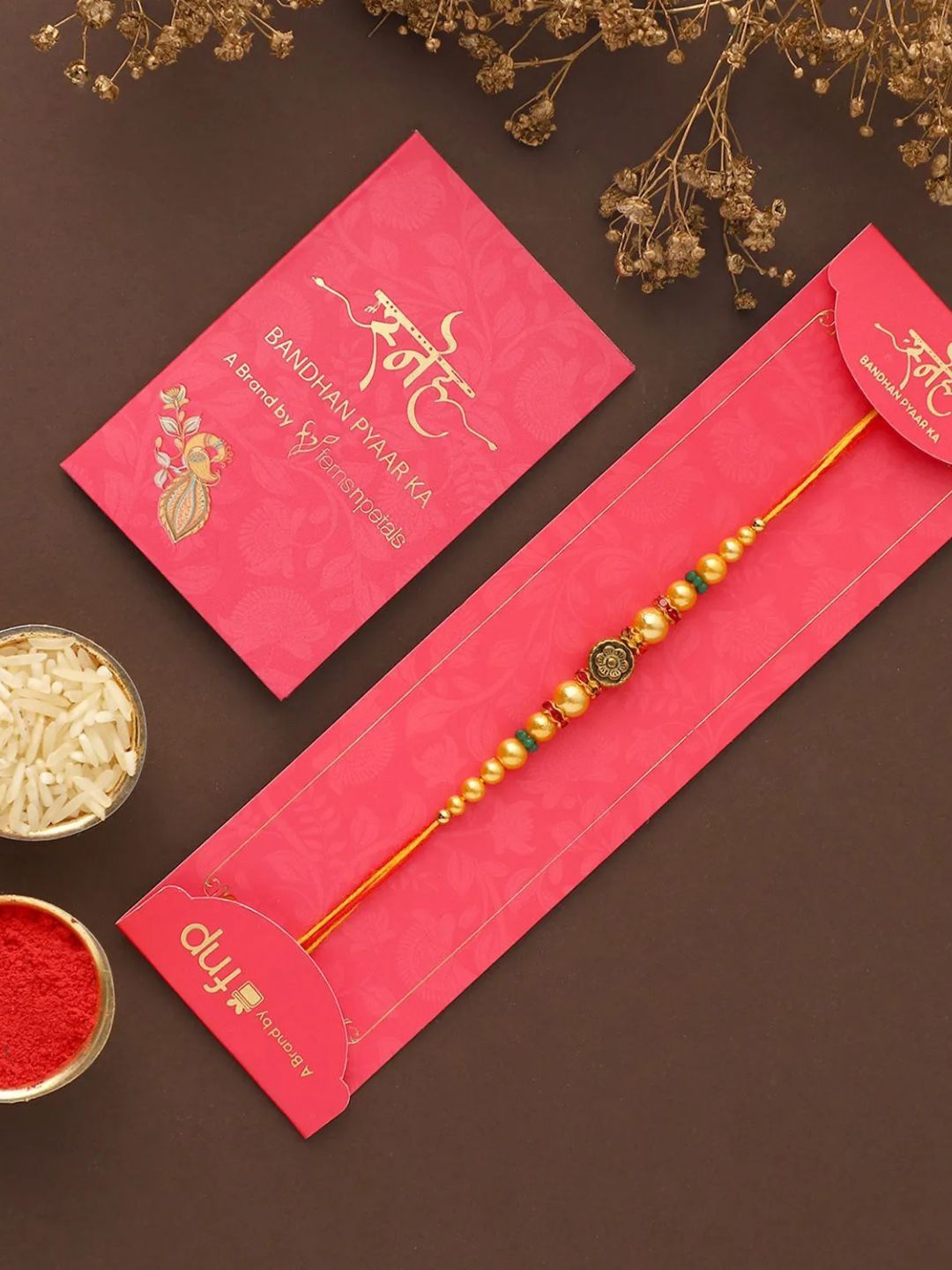 

fnp Celestial Beads Rakhi Bhaiya-Bhabhi Rakhis, Gold
