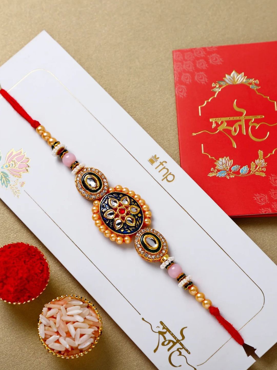 

fnp Ornate Opulence Rakhi Magical Evil Eye, Red