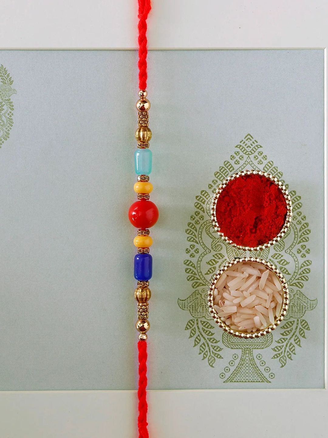 

fnp Sneh Colourful Pearl Rakhi Classic Pearls, Red