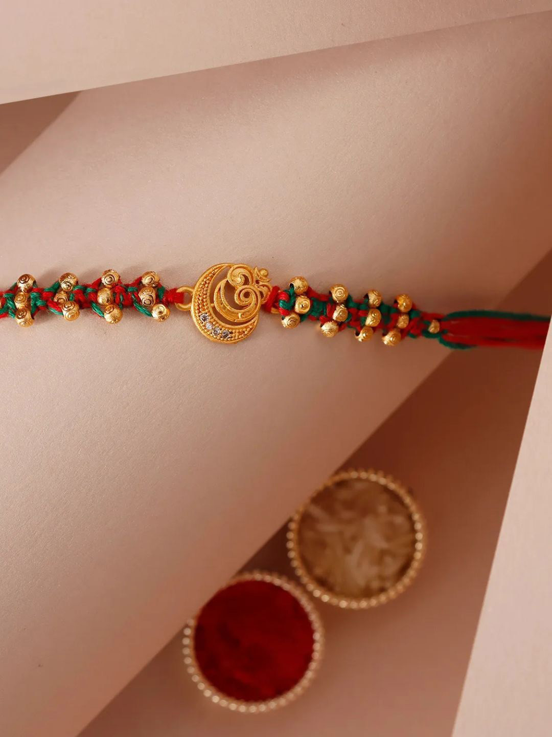 

fnp Sneh Golden Touch Om Rakhi American Diamond, Gold