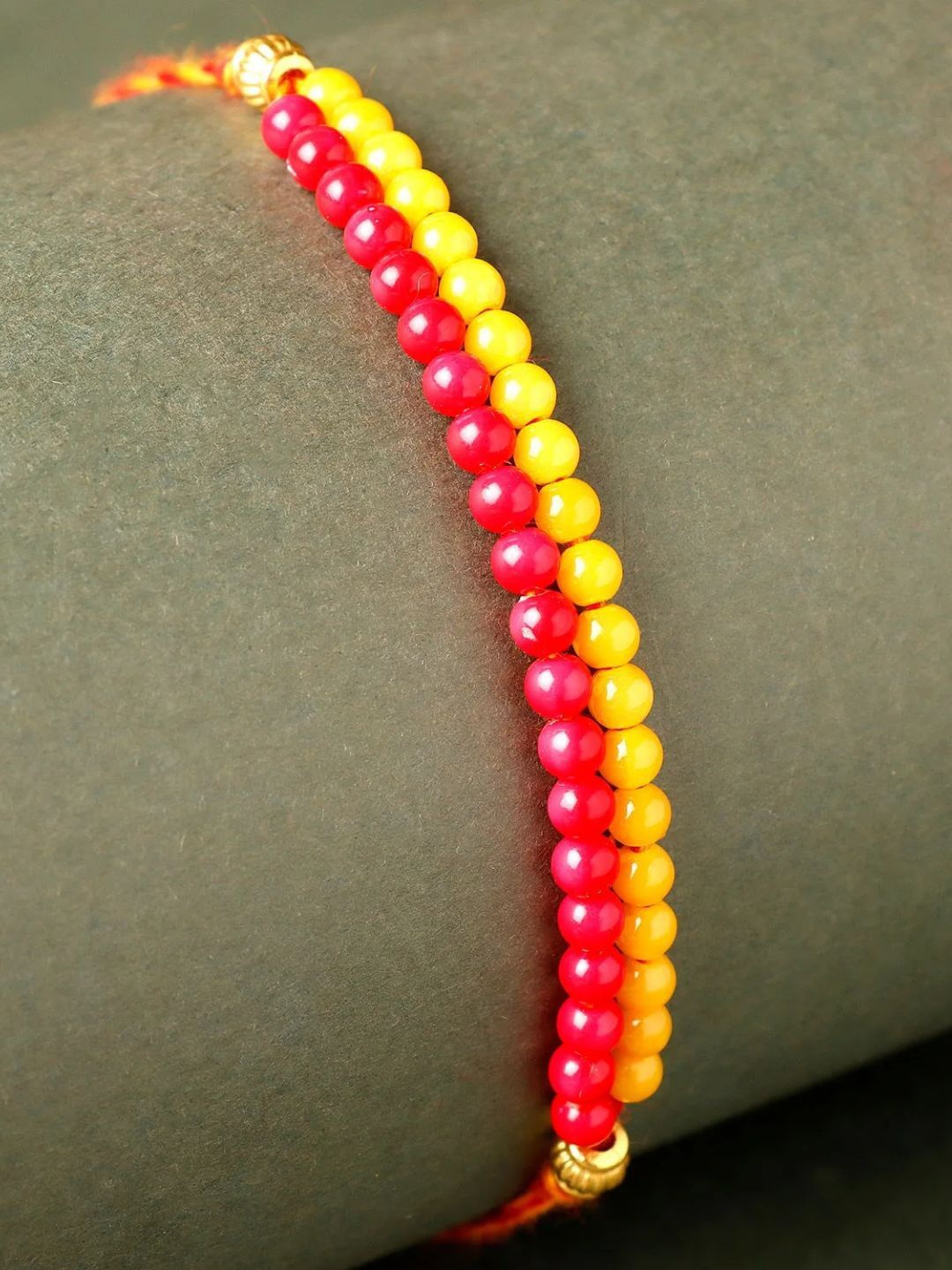 

fnp Magenta Mauli Rakhi Bhaiya-Bhabhi Rakhis, Yellow