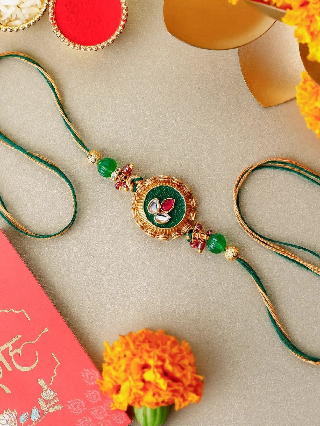 

fnp Royal Emerald Kundan Rakhi Traditional Kundan, Gold