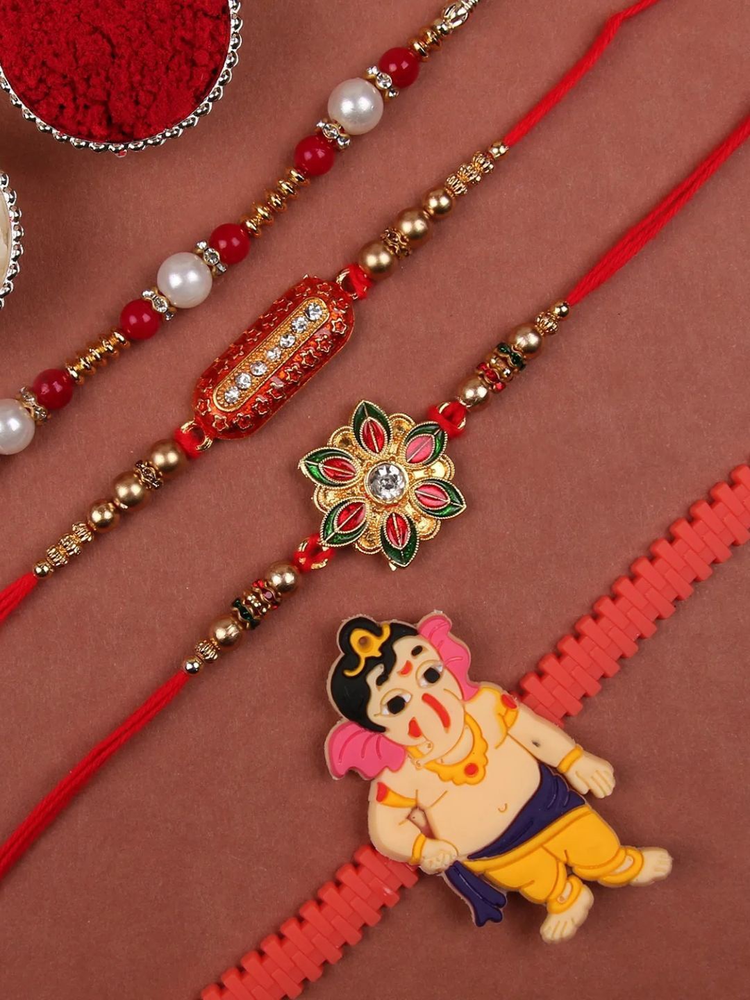 

fnp Designer Rakhi Set Of 4 Traditional Kundan, Red