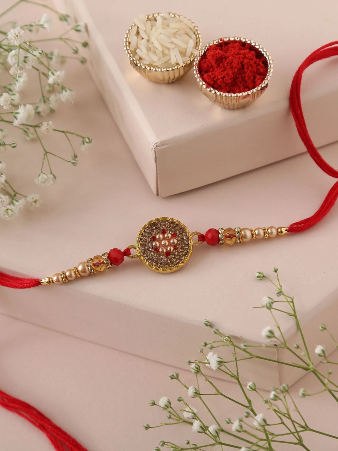 

fnp Crimson Majesty Rakhi Traditional Kundan, Gold