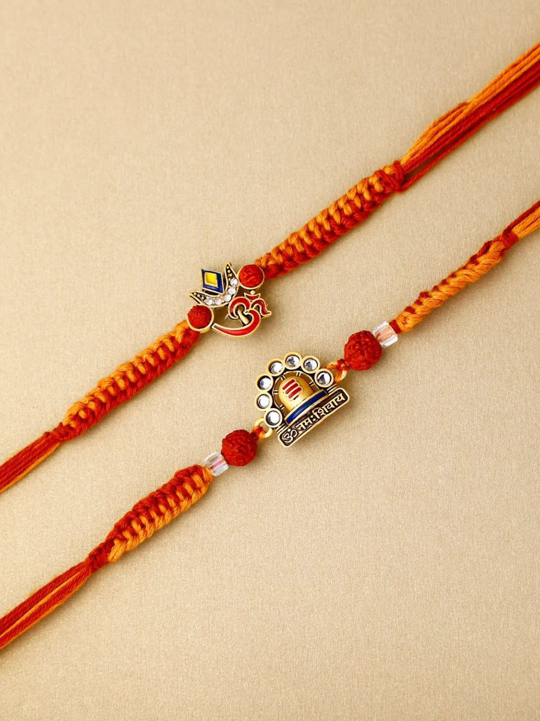 

fnp Om Namah Shivay Rakhi Duo Classic Pearls, Red
