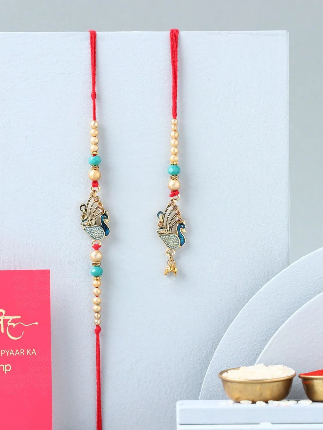 

fnp Regal Peacock Harmony Lumba Rakhi Set American Diamond, Red