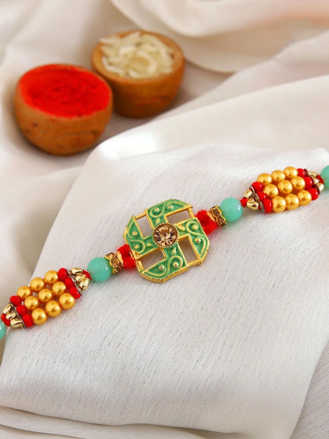 

fnp Sacred Swastik Rakhi Kids Collection, Red