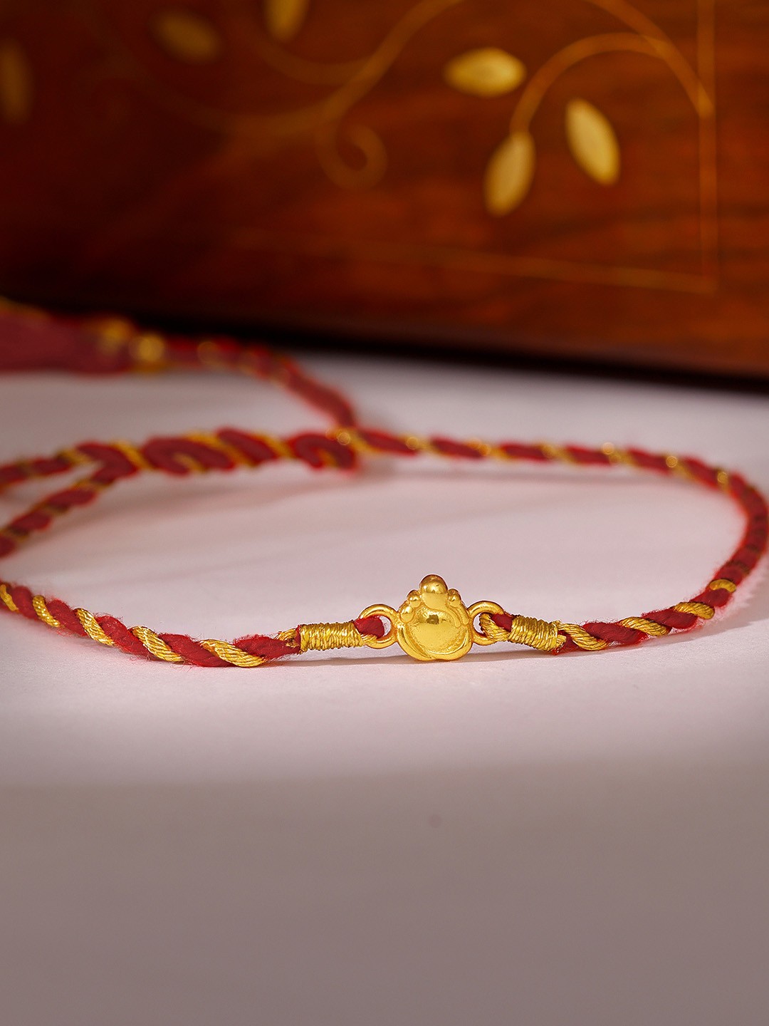 

GIVA Men 925 Sterling Silver Gold-Plated & Red Little Lord Ganesh Rakhi & Roli Chawal