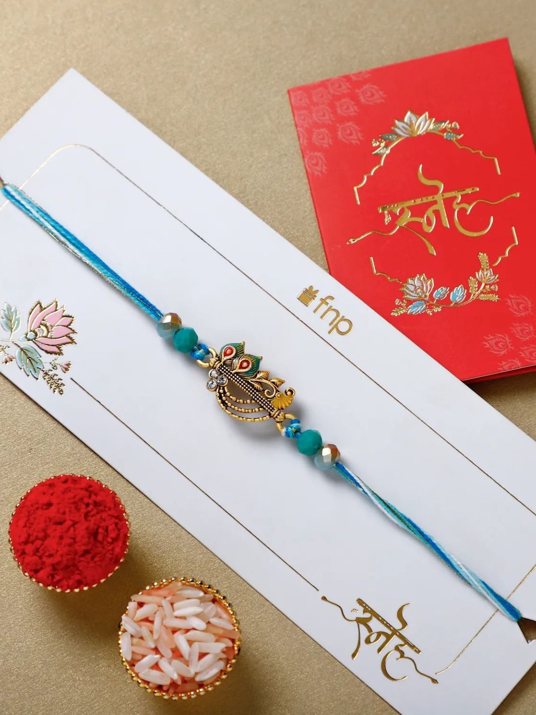 

fnp Melodic Krishna Flute Rakhi Silver Selections, Blue