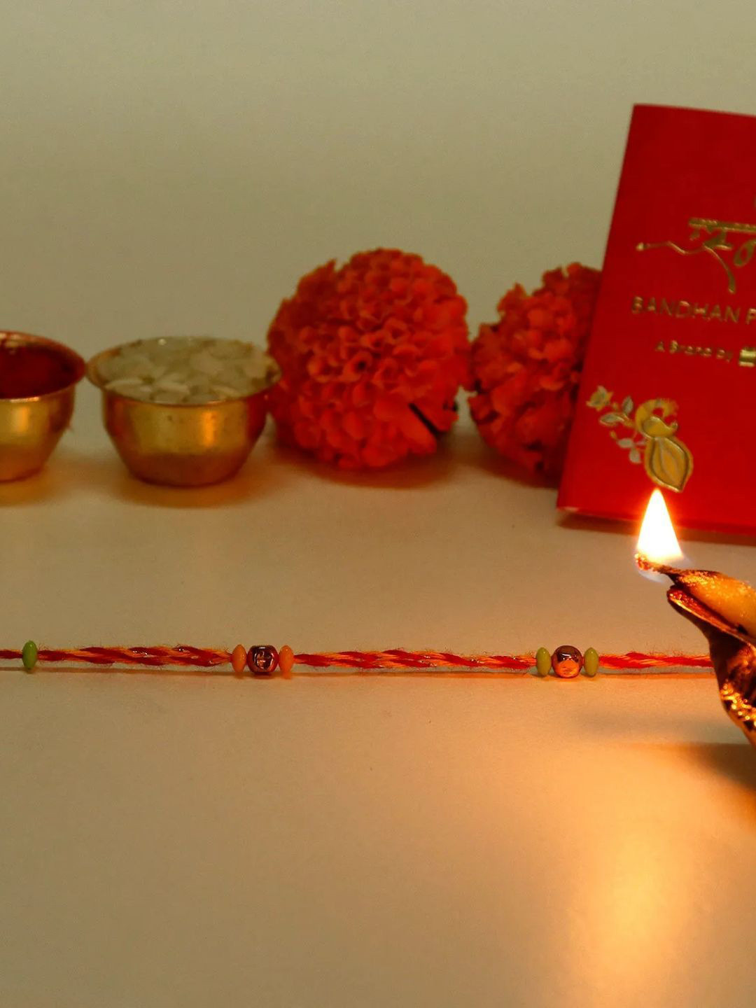 

fnp Saffron Lush Mauli Rakhi Magical Evil Eye, Red
