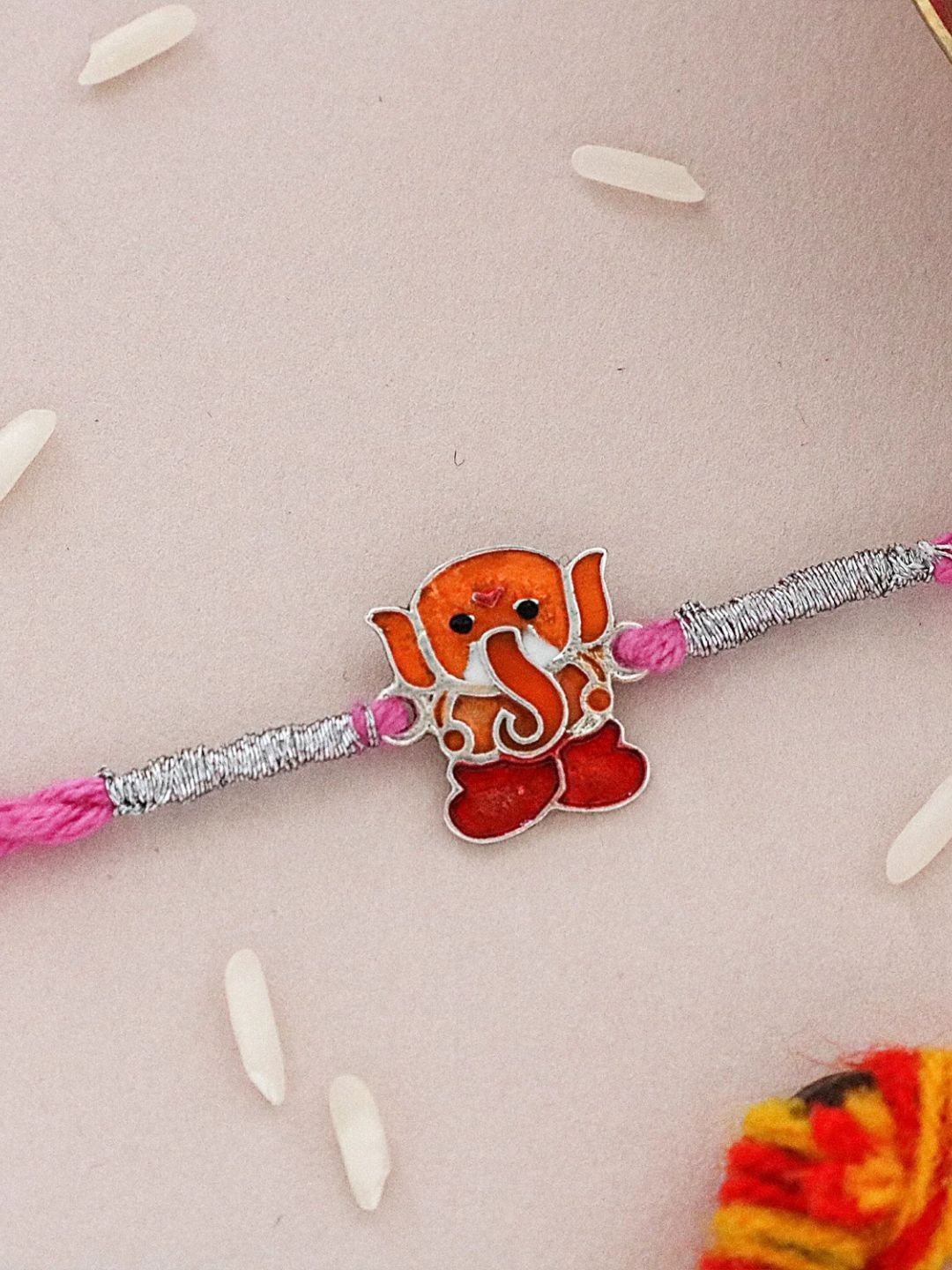 

fnp Eternal Bond Ganesha Rakhi Bhaiya-Bhabhi Rakhis, Orange