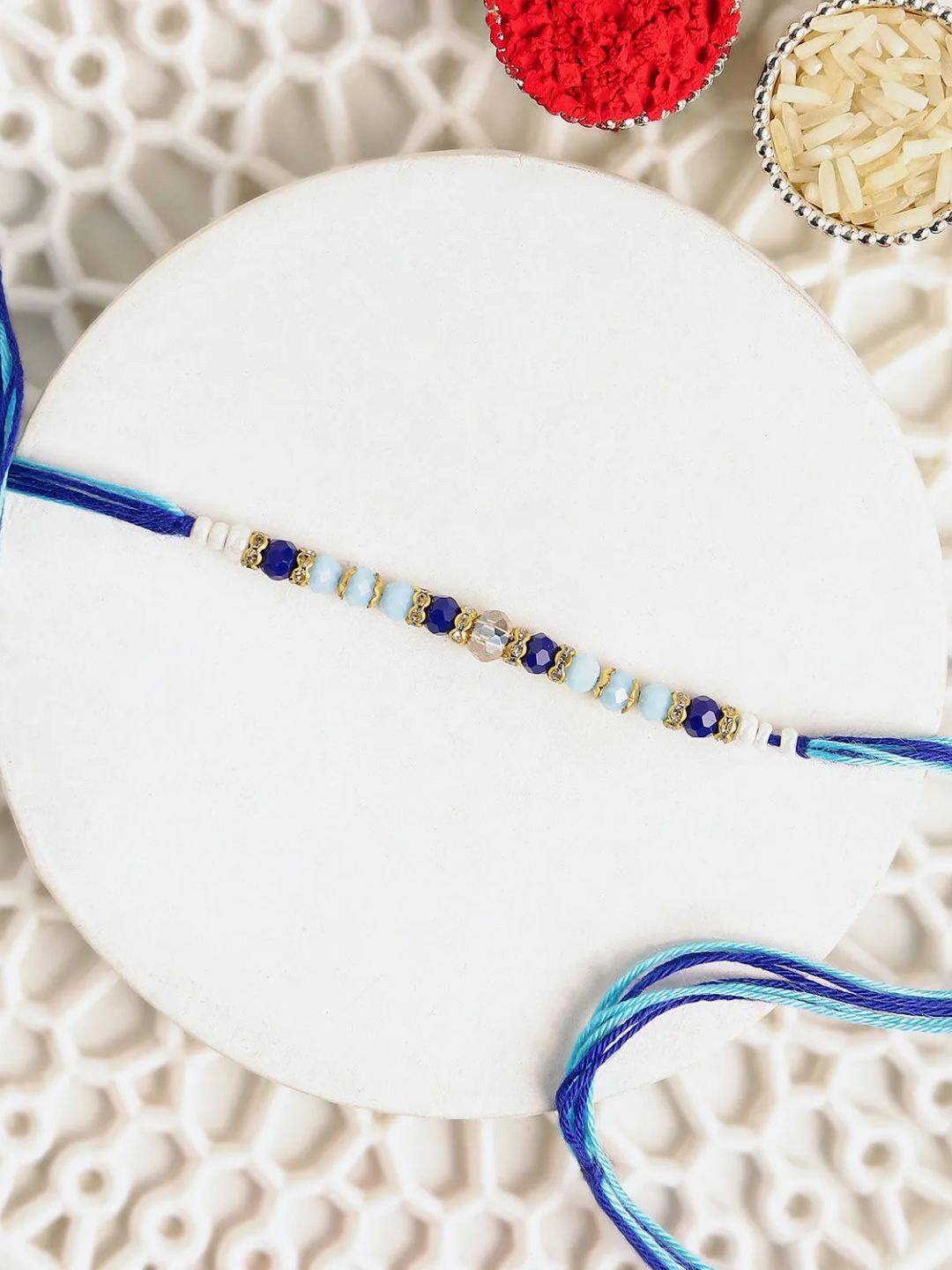 

fnp Cerulean Blue Simple Dhaga Rakhi Bhaiya-Bhabhi Rakhis