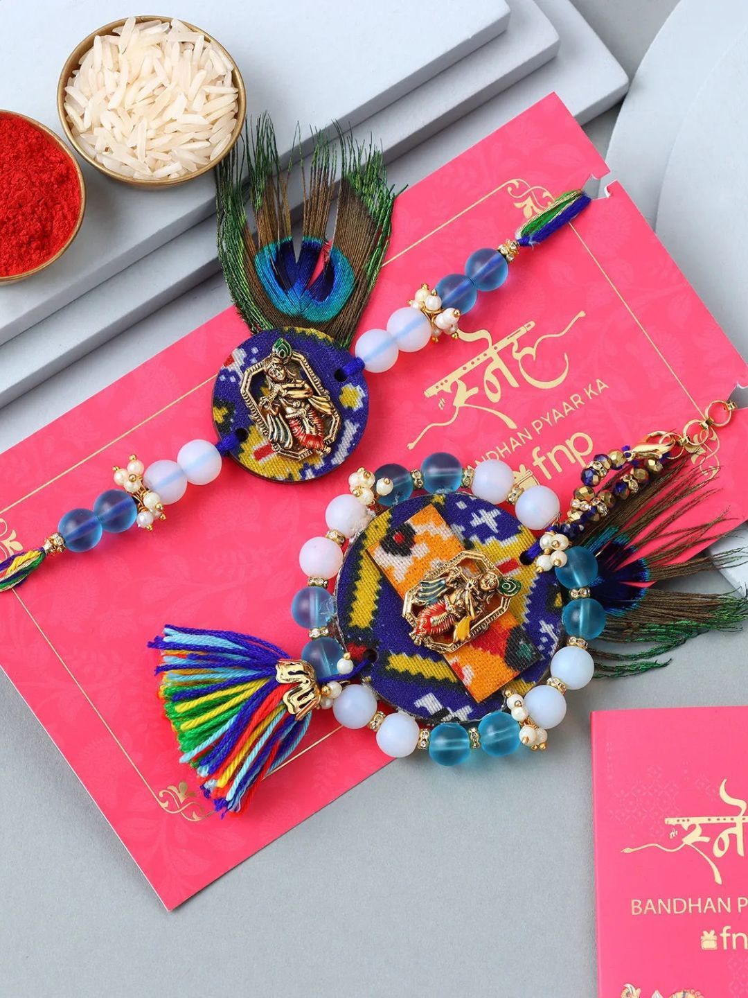 

fnp Divine Krishna Peacock Harmony Lumba Rakhi Set Traditional Kundan, Blue