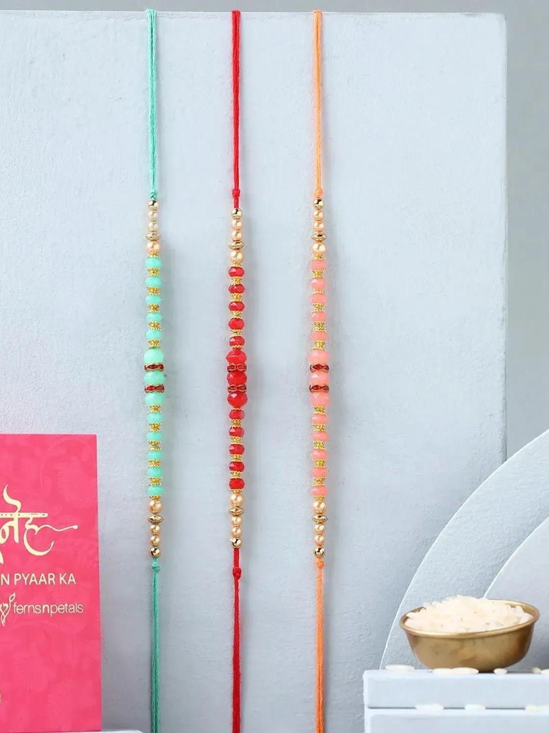 

fnp Sibling Harmony Ethnic Rakhi Set of 3 American Diamond, Gold