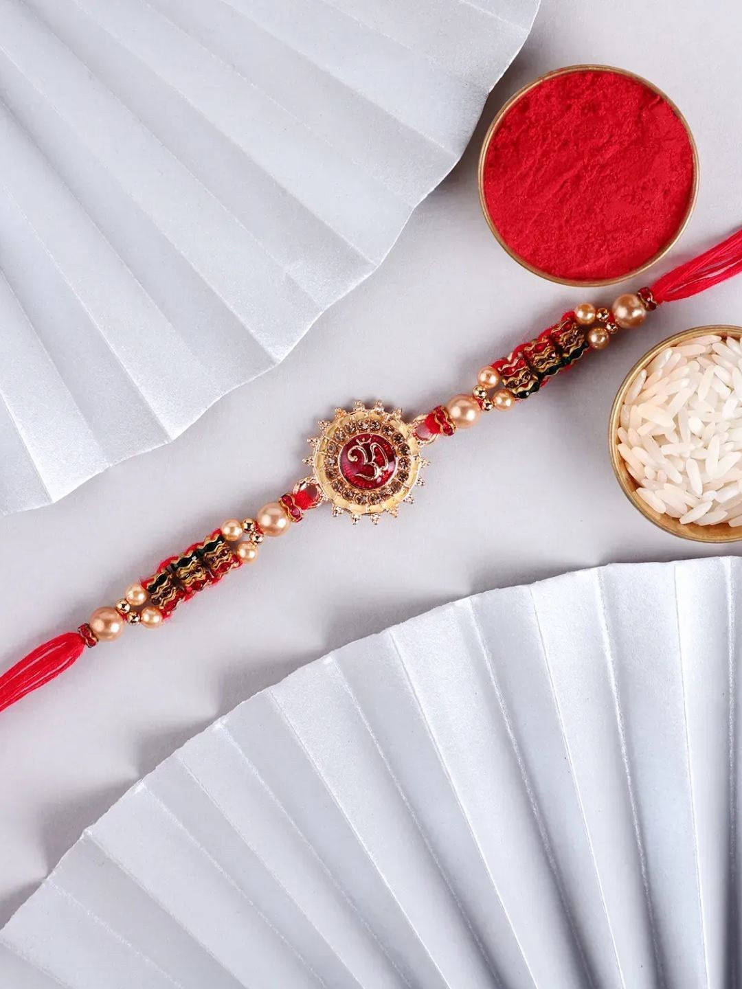

fnp Divine Radiance Om Rakhi Mauli Rakhis, Gold