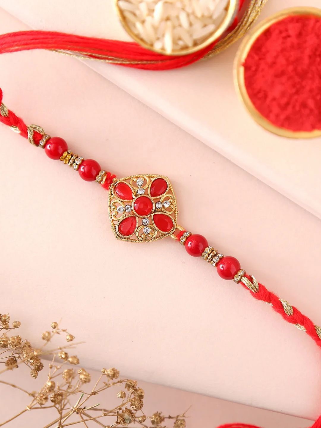 

fnp Sneh Modish Pearl Red Rakhi Classic Pearls