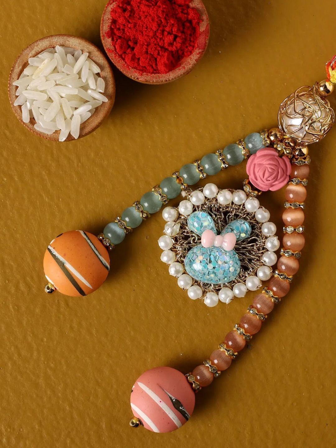 

fnp Traditional Lum Rakhi American Diamond, Gold