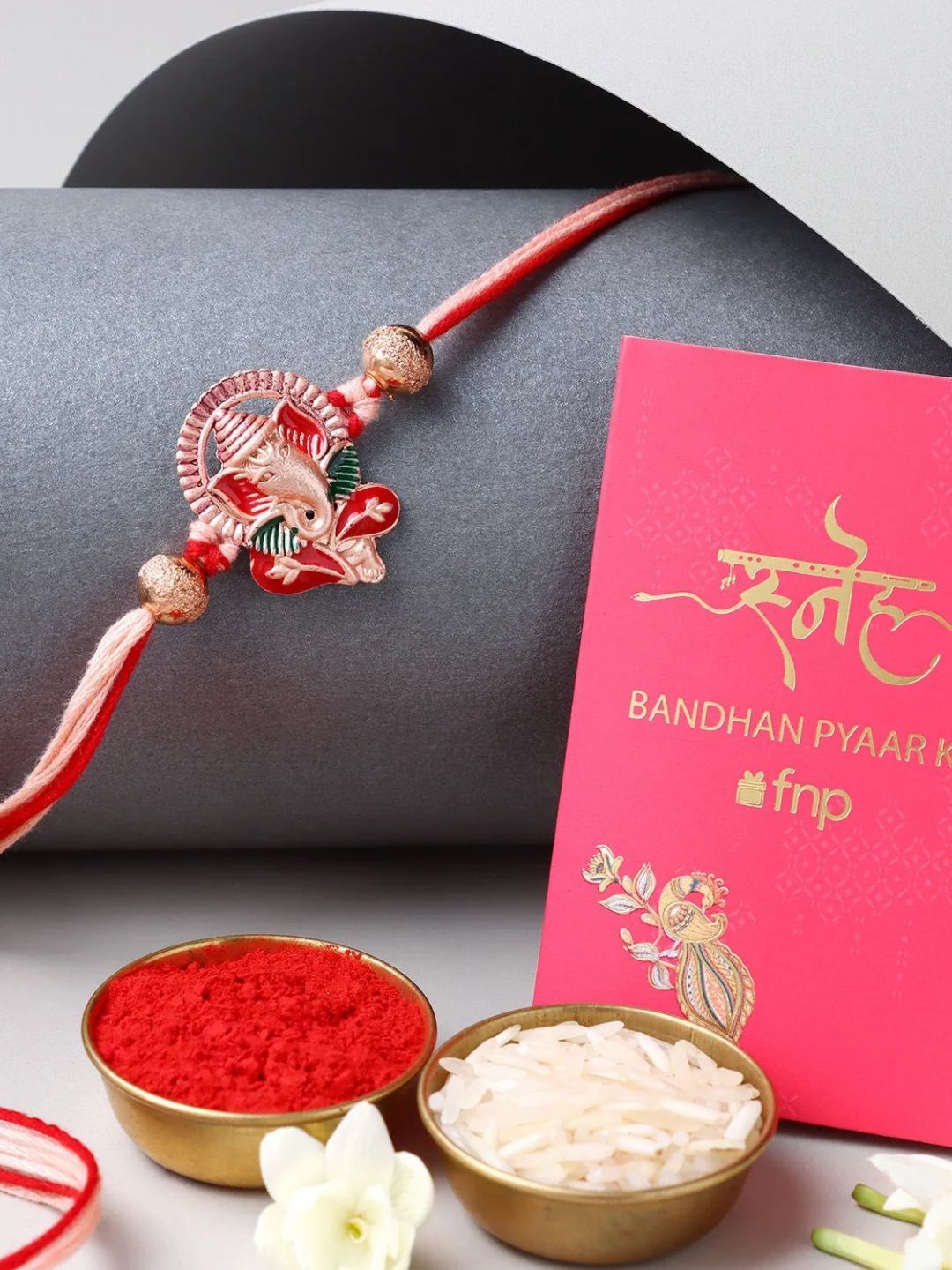 

fnp Lively Pearl Red Lumba Bhaiya-Bhabhi Rakhis, Gold