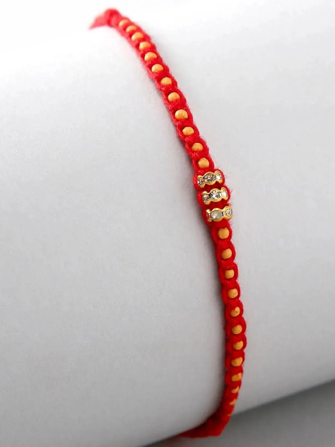 

fnp Fancy Minimalist Design Rakhi Magical Evil Eye, Red
