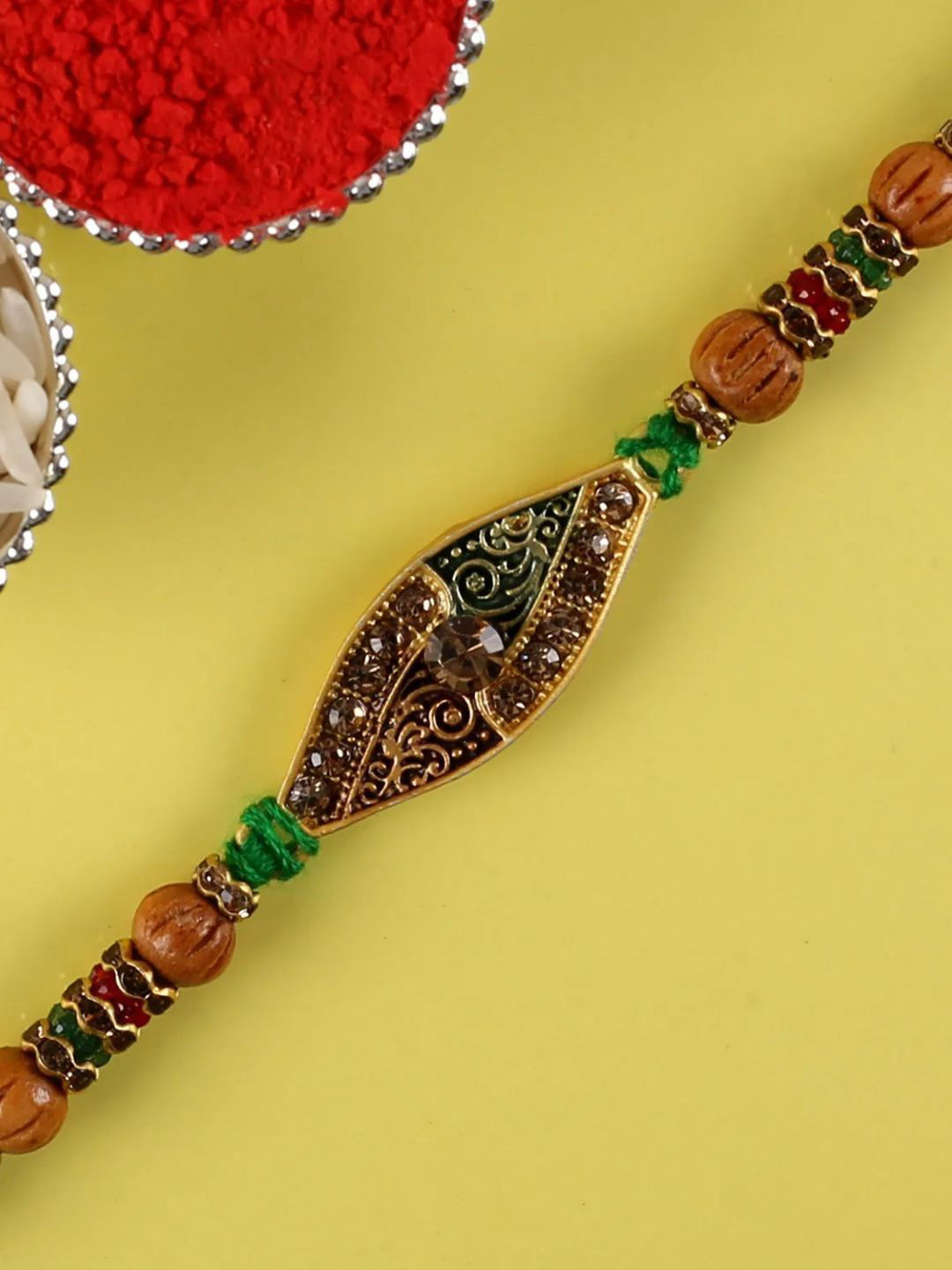 

fnp Artistic Aura Meenakari Rakhi Magical Evil Eye, Green
