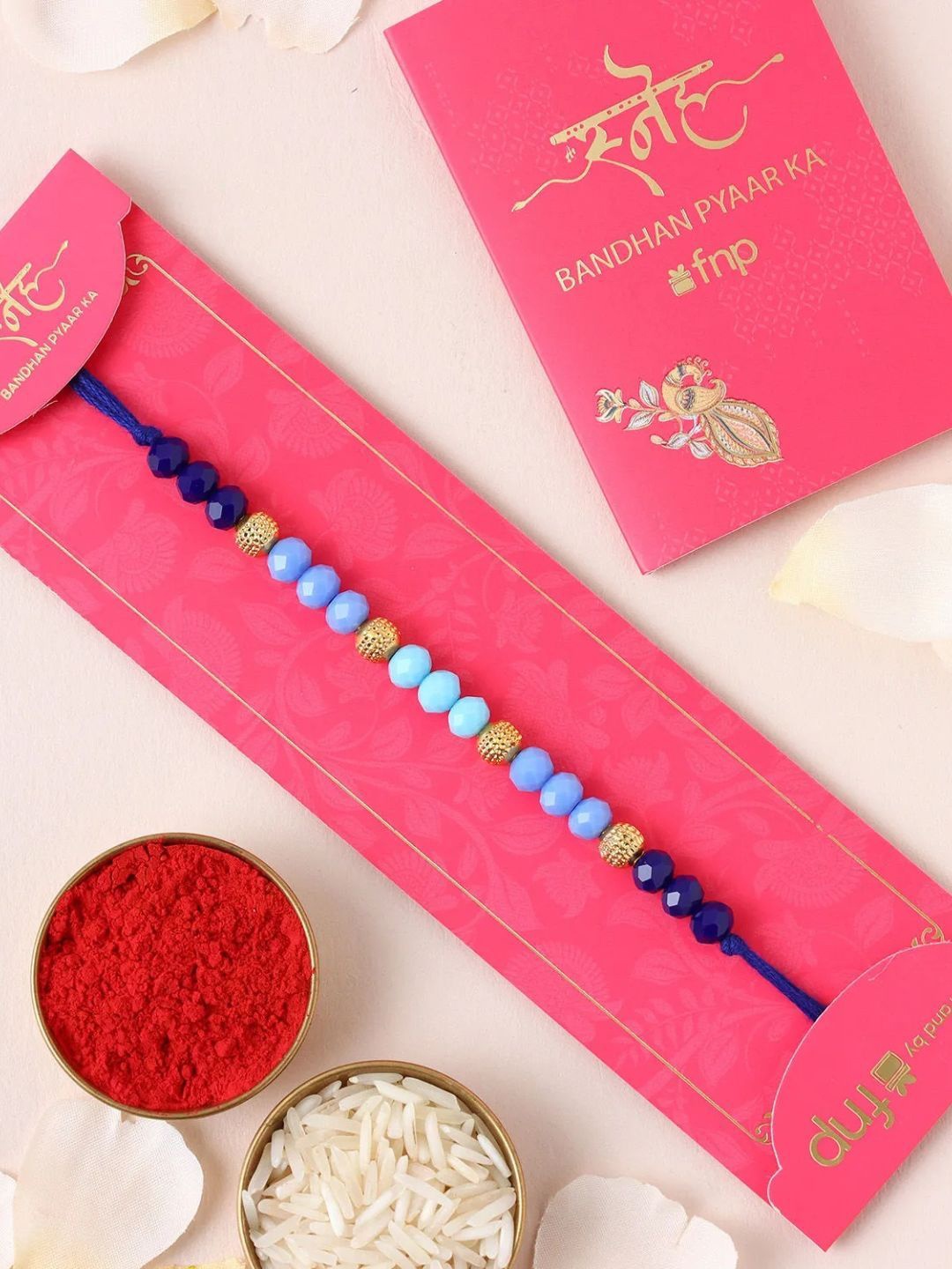 

fnp Tranquil Harmony Beads Rakhi Bhaiya-Bhabhi Rakhis, Blue