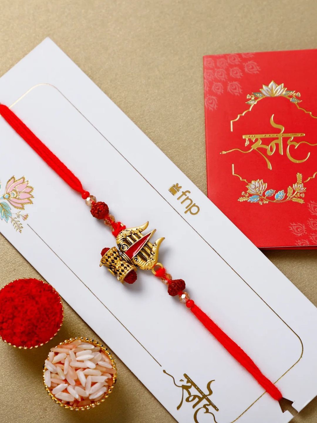 

fnp Intricate Trishul Rakhi Lumba Rakhis, Red