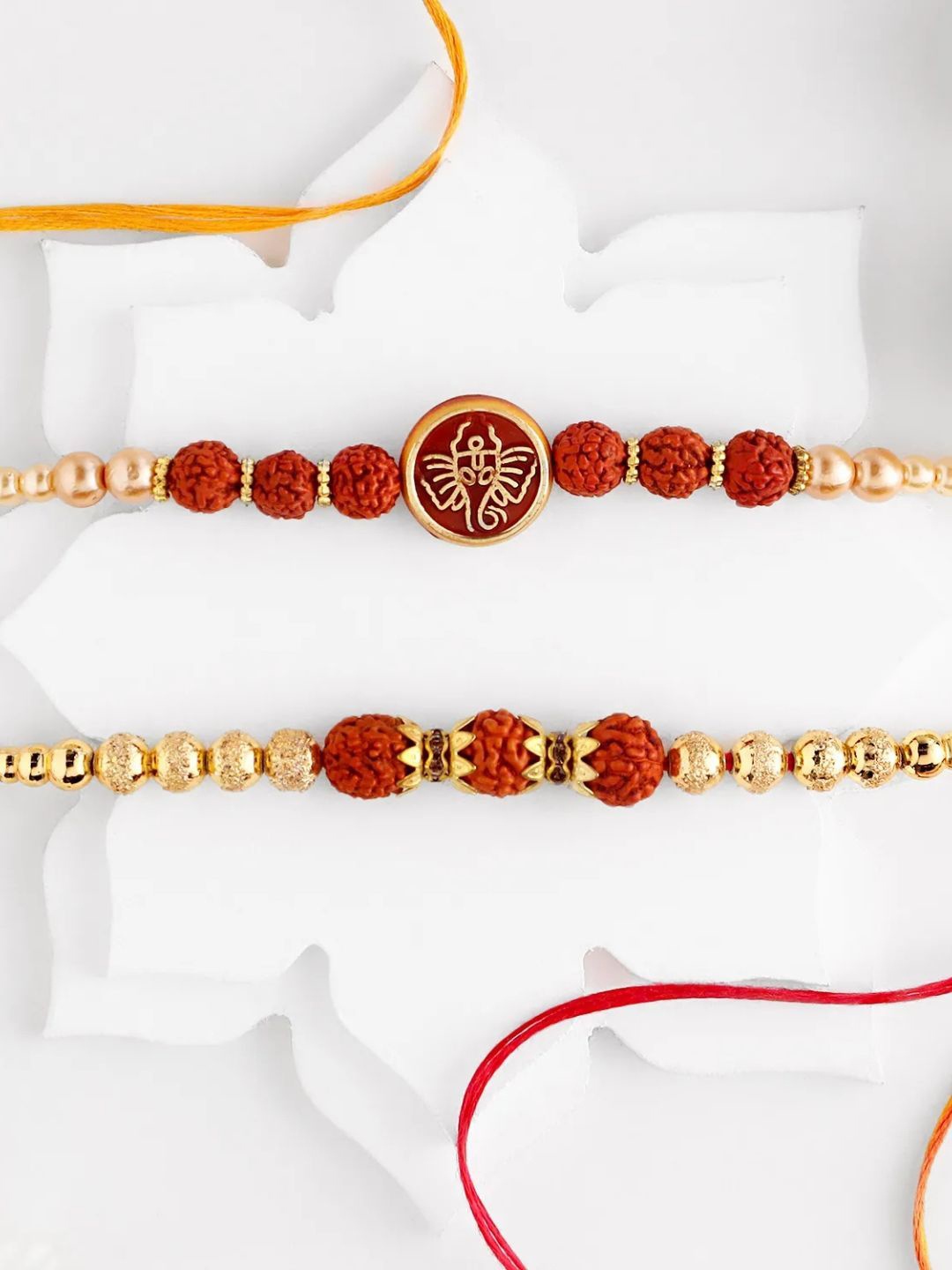 

fnp Serene Spirit Rudraksha Rakhi Magical Evil Eye, Red