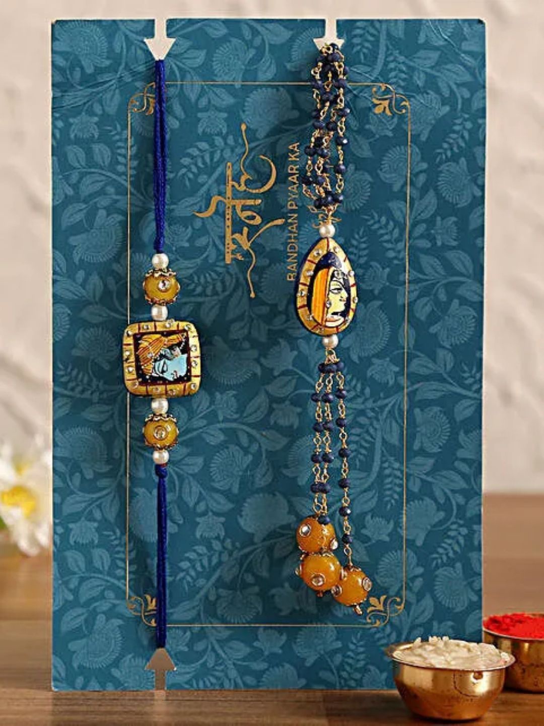 

fnp Sneh Radha Krishna Bhaiya Bhabhi Rakhi Set Magical Evil Eye, Gold