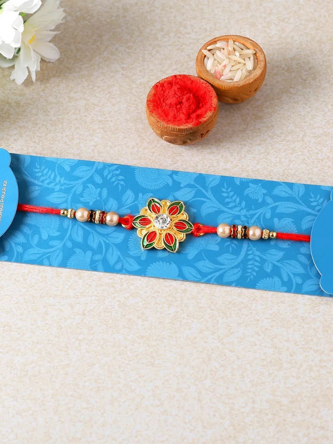 

fnp Floral Bliss Meenakari Rakhi Magical Evil Eye, Red