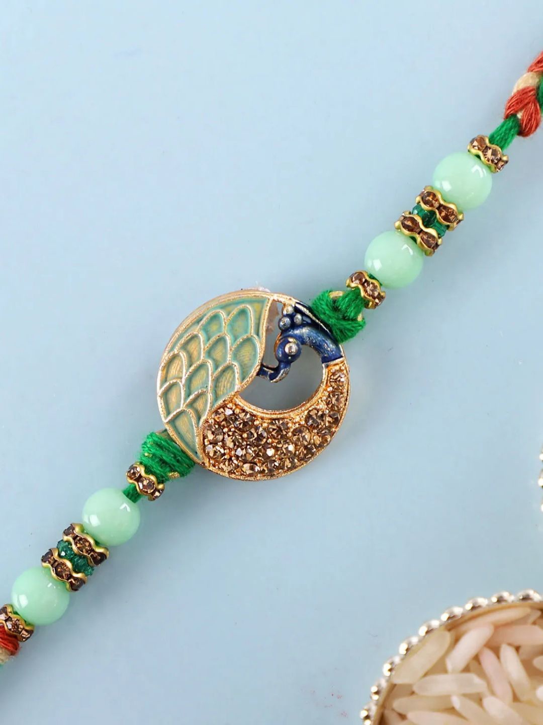 

fnp Regal Plumage Rakhi Bhaiya-Bhabhi Rakhis, Green