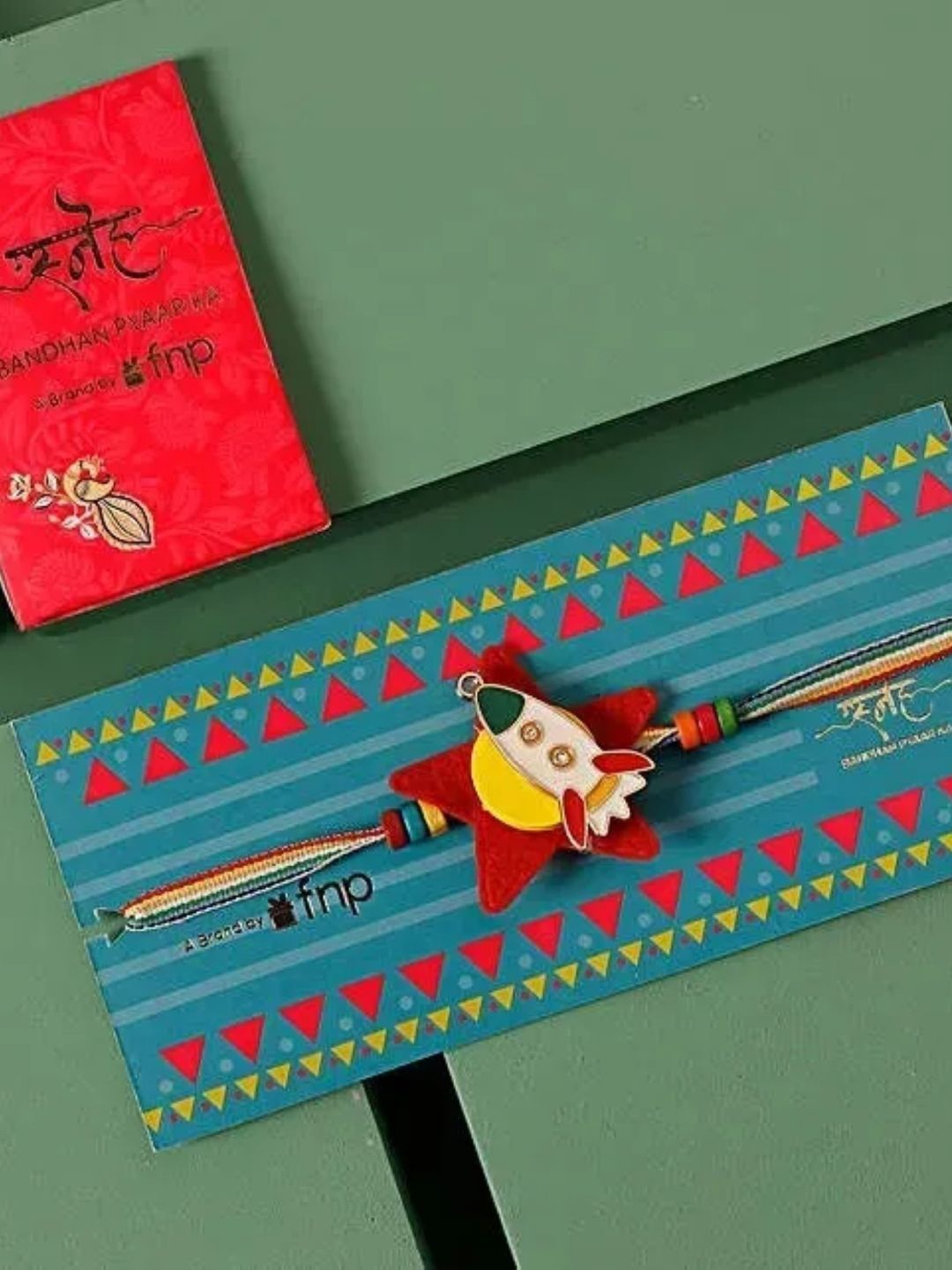

fnp Joyful Beginnings Bal Ganesha Rakhi Mauli Rakhis, Red